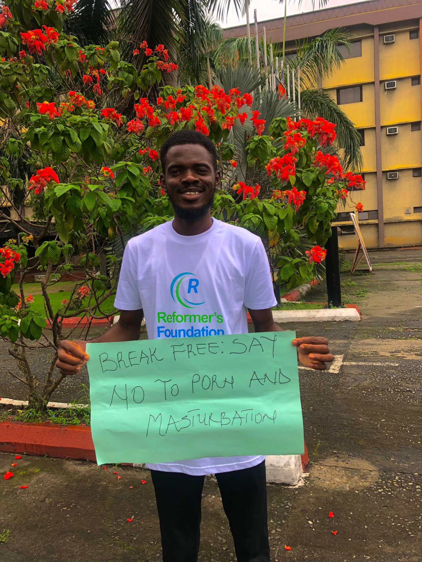 Volunteer holding a Break Free campaign placard